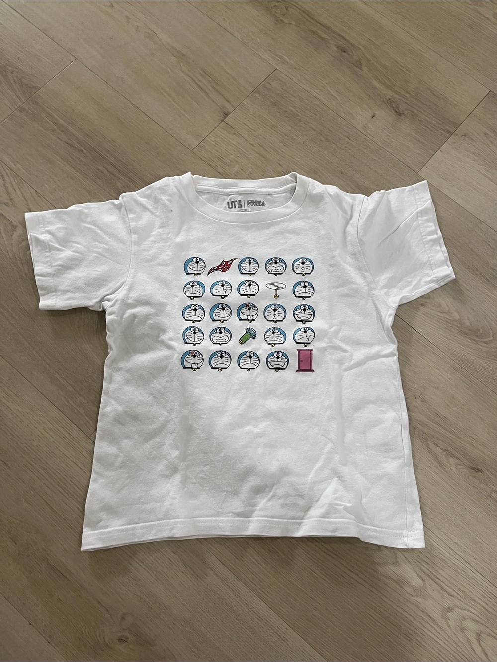 Uniqlo White Kids Tee with Character Icon Grid